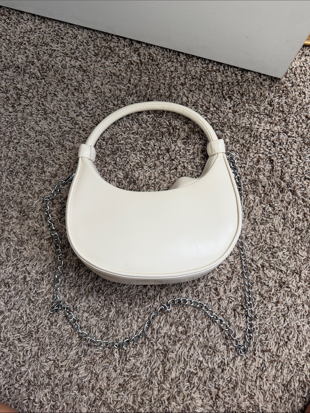 Cream Leather Crescent Handbag with Removable Chain Strap and Magnetic Closure